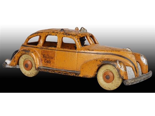 CAST IRON HUBLEY CAR WITH DRIVER TOY.             