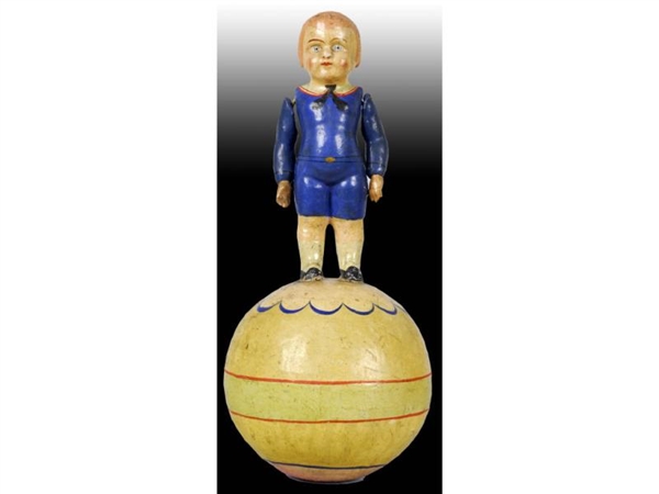 PAPER MACHE ROLY POLY BOY STANDING ON BALL.       