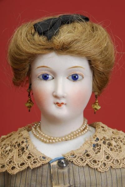 RARE PARIAN WITH GLASS EYES AND WIG               