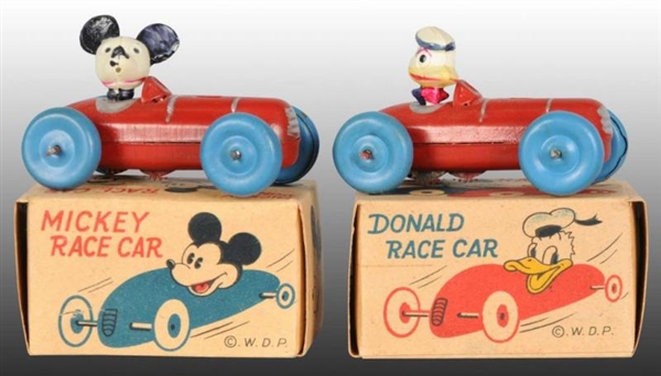 LOT OF 2: OCCUPIED JAPANESE DISNEY RACE CAR TOYS. 