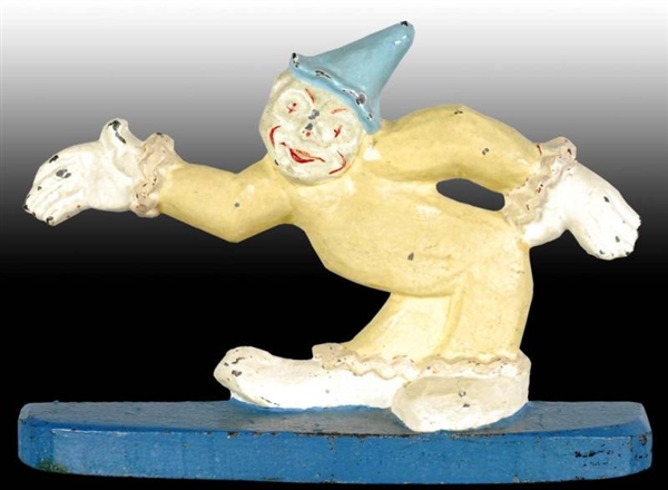 CAST IRON CLOWN WITH OUTSTRETCHED ARMS DOORSTOP.  