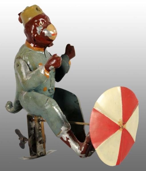 TIN HAND-PAINTED MONKEY WIND-UP TOY.              