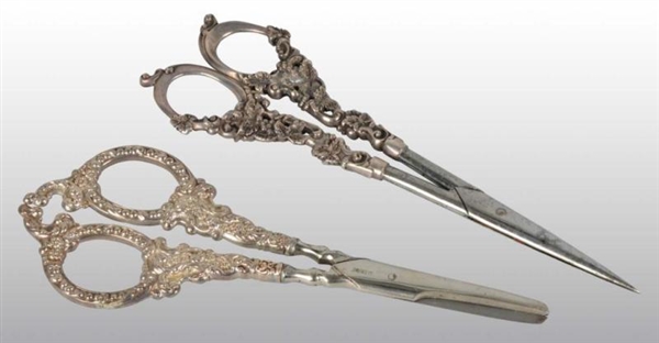LOT OF 2: PAIRS OF SILVER HANDLED SCISSORS.       