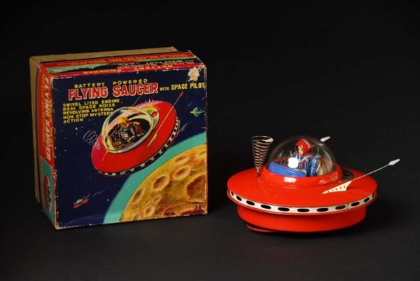 FLYING SAUCER WITH SPACE PILOT TOY.               