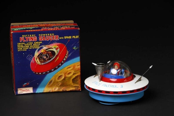 TIN FLYING SAUCER BATTERY-OPERATED TOY.           