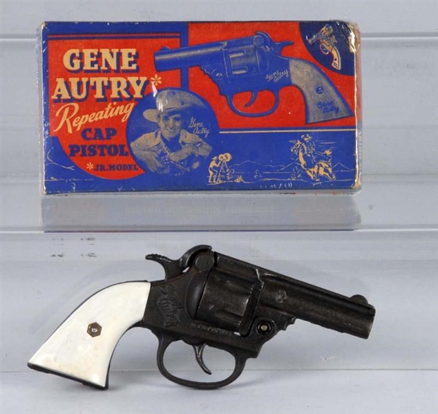 CAST IRON GENE AUTRY CAP GUN.                     