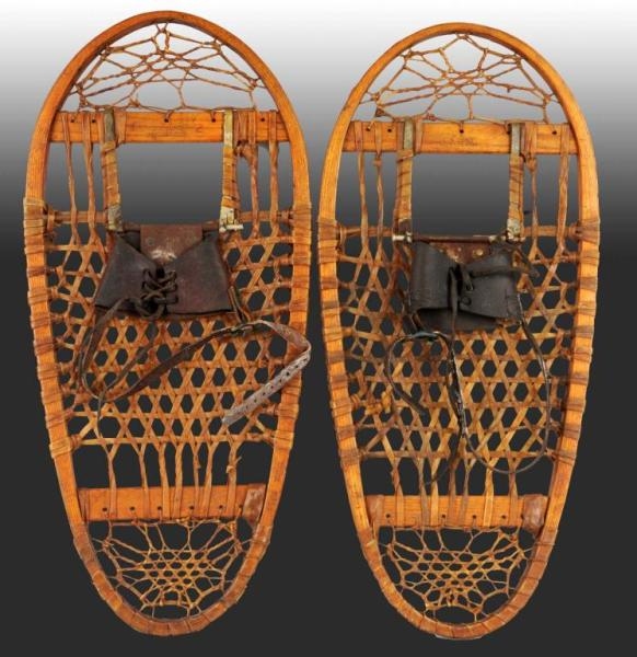 PAIR OF SNOW SHOES BY G. A. LUND, MINNESOTA.      