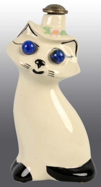 CAT WITH BLUE MARBLE EYES IRONING SPRINKLER.      
