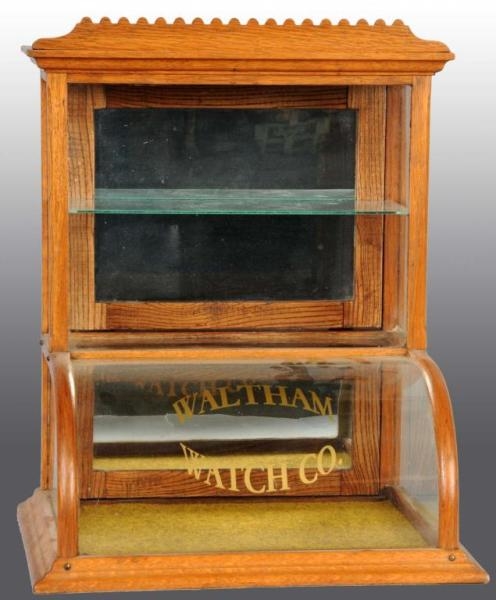 CURVED GLASS WALTHAM WATCH CO. DISPLAY CASE.      