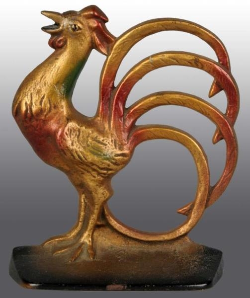 CAST IRON ROOSTER WITH FANTAIL DOORSTOP.          
