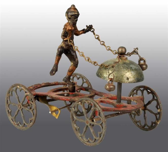 CAST IRON TRAMP BELL TOY.                         