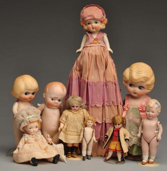 LOT OF 9: BISQUE DOLLS.                           