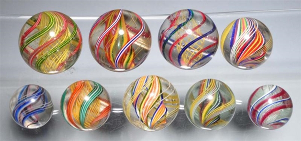 LOT OF 9: MULTI-COLOR SWIRL MARBLES.              
