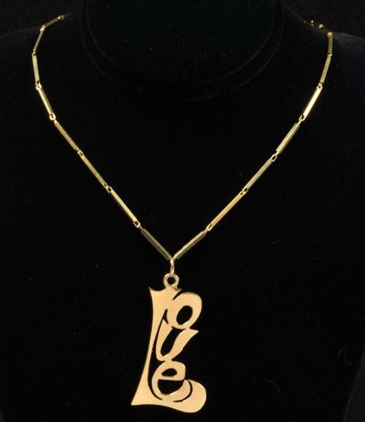 14K Y. GOLD NECKLACE WITH LOVE PENDANT.           