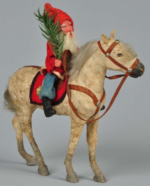 SANTA RIDING HORSE WITH DRESDEN FLOWER.           