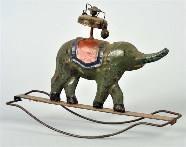 EARLY TIN ELEPHANT BELL TOY.                      