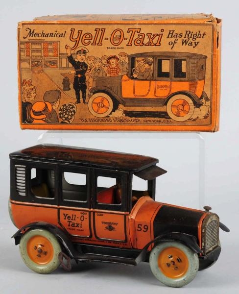TIN LITHO STRAUSS YELLOW TAXI WIND-UP TOY.        