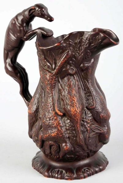 HOUND-HANDLED PITCHER WITH HANGING GAME.          