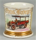 ANTIQUE OPEN TRUCK WITH DRIVER SHAVING MUG.       
