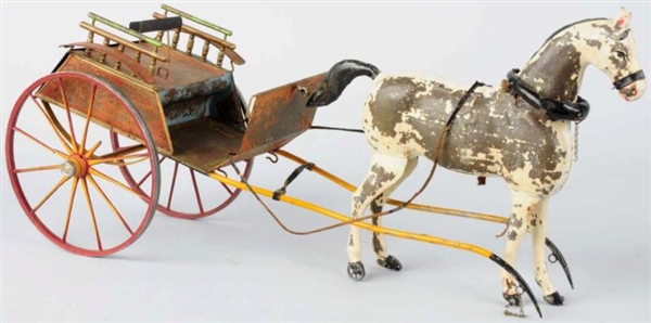 EARLY TIN HORSE-DRAWN TRAP TOY.                   