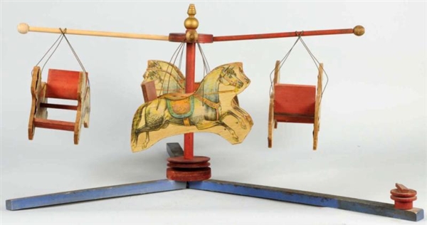 EARLY PAPER ON WOOD CAROUSEL TOY.                 