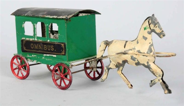 EARLY HAND-PAINTED TIN OMNIBUS TOY.               