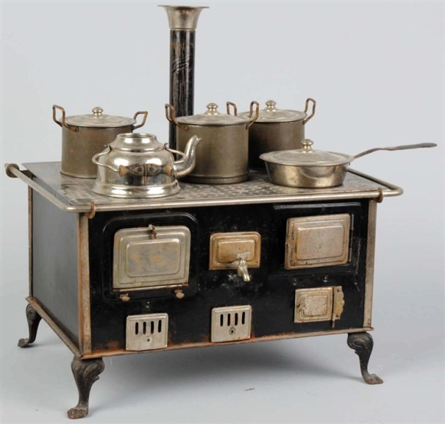 EARLY TIN CHILDS TOY STOVE.                      