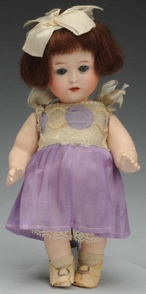 SAUCY GERMAN BISQUE CHARACTER TODDLER DOLL.       