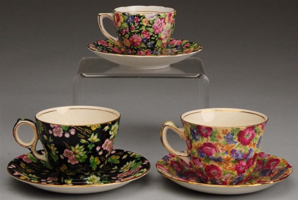 LOT OF 3: FLORAL CHINTZ CUP & SAUCER SETS.        