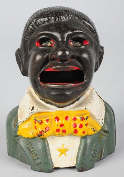 CAST IRON UNCLE TOM MECHANICAL BANK.              