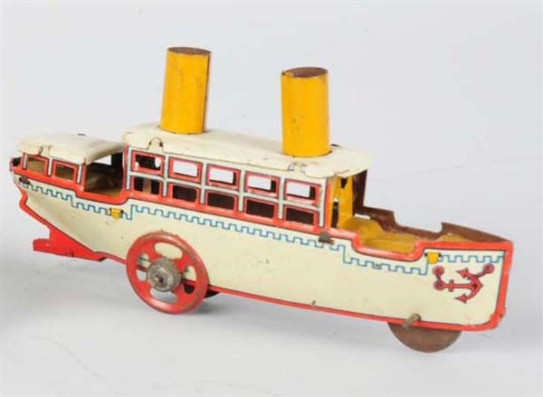 TIN LITHO TWO-STACK PADDLE BOAT PENNY TOY.        