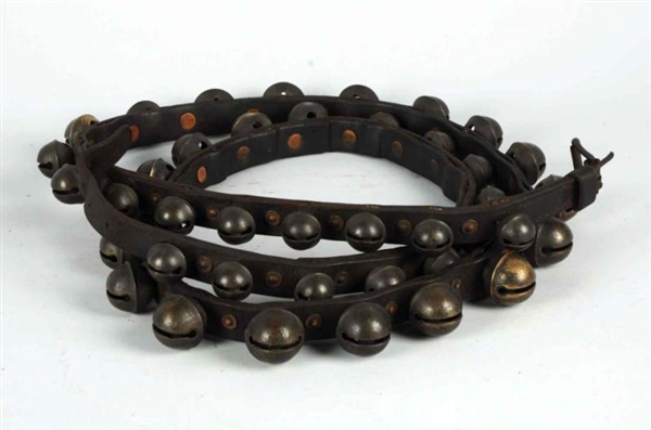 LEATHER BELT WITH 40 BRASS SLEIGH BELLS.          