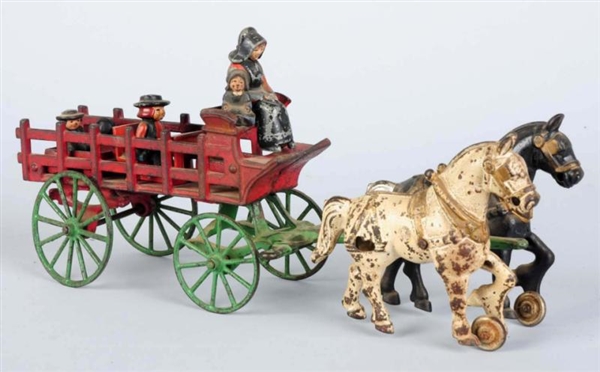 CAST IRON OPEN WAGON WITH AMISH FIGURES.          
