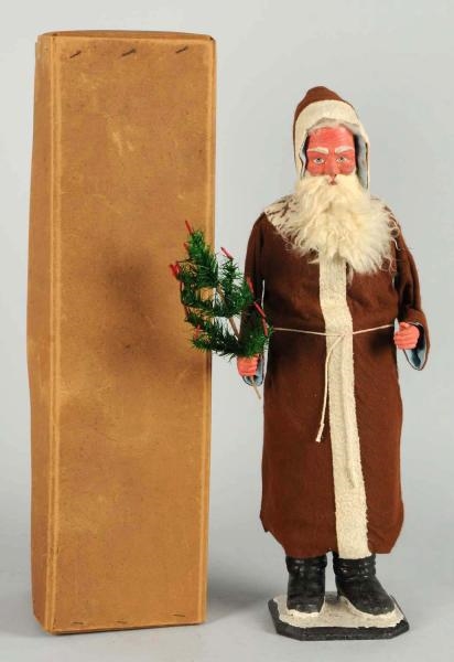 PAPER MACHE SANTA IN BROWN ROBE CANDY CONTAINER.  