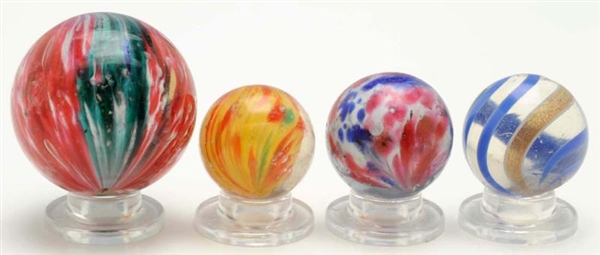 LOT OF 4: ASSORTED HANDMADE MARBLES.              