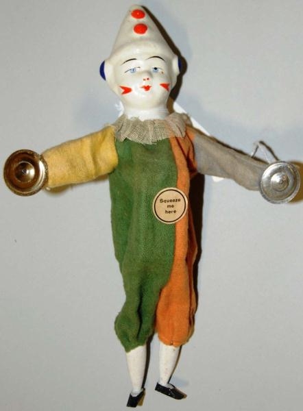 CLOWN TOY WITH CYMBALS.                           