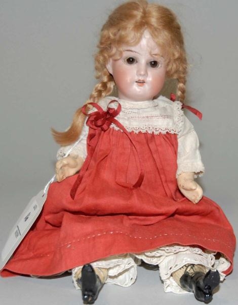 CHINA HEAD DOLL WITH GLASS EYES.                  