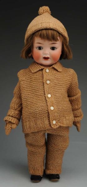 SMILING GERMAN BISQUE CHARACTER DOLL.             