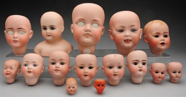 LOT OF 15: BISQUE DOLL HEADS.                     