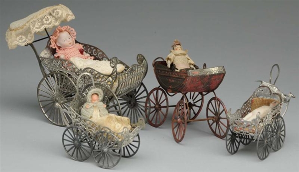 LOT OF TINY DOLLS AND BUGGIES.                    