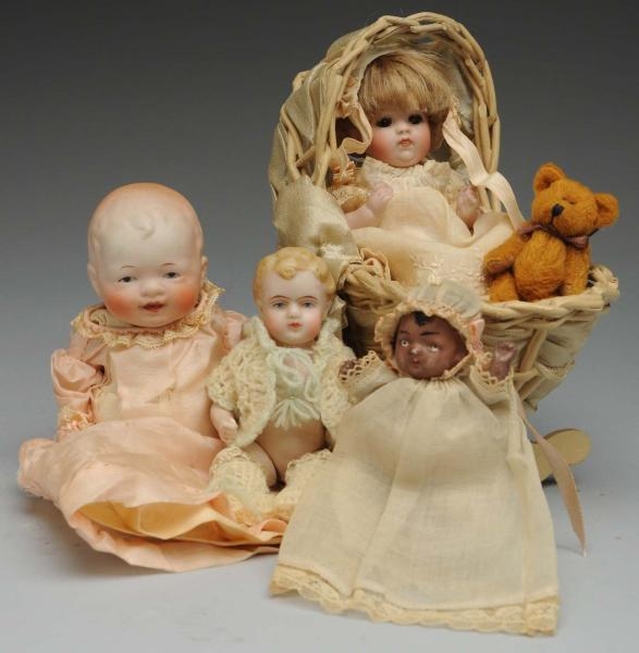 LOT OF BABY DOLLS AND CRADLE.                     