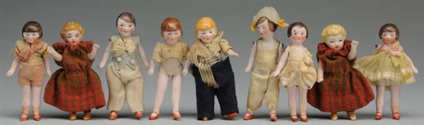 LOT OF 9: GERMAN ALL-BISQUE DOLLS.                