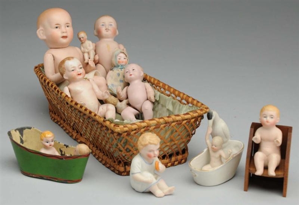 LOT OF ALL-BISQUE BABY DOLLS AND ACCESSORIES.     
