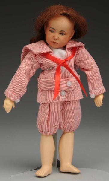 UNUSUAL BISQUE CHARACTER DOLL.                    