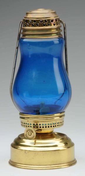SKATERS LANTERN WITH LIGHT BLUE GLASS.           