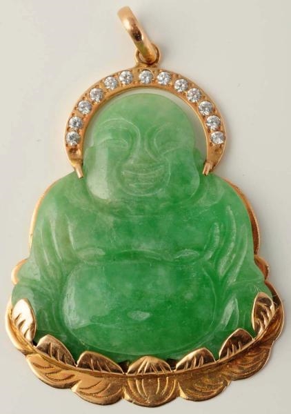 14K YELLOW GOLD RIMMED CARVED JADE BUDDHA.        