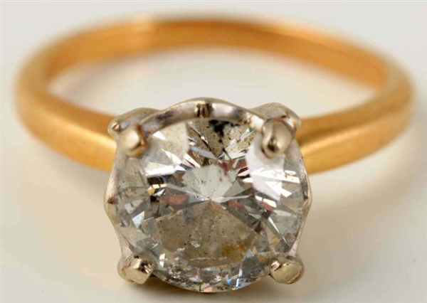 14K YELLOW GOLD DIAMOND SOLITAIRE RING.           
