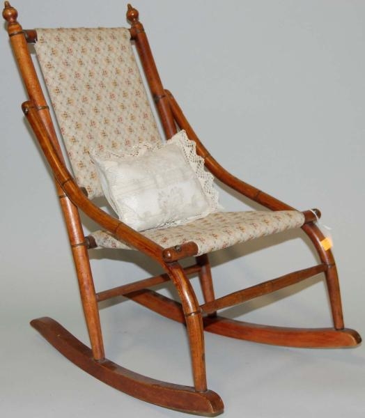 WOODEN DOLLS ROCKING CHAIR WITH SMALL PILLOW.    