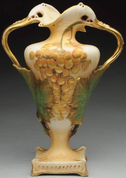 AMPHORA FOOTED VASE WITH SCULPTED LEAVES.         