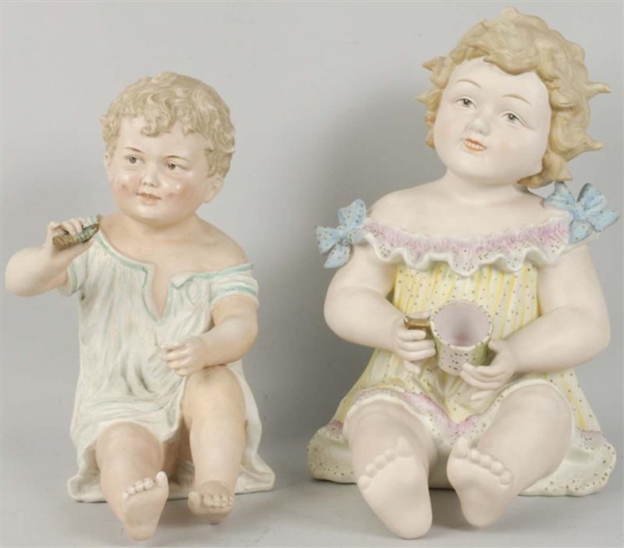 LOT OF 2: BISQUE PIANO BABIES.                    